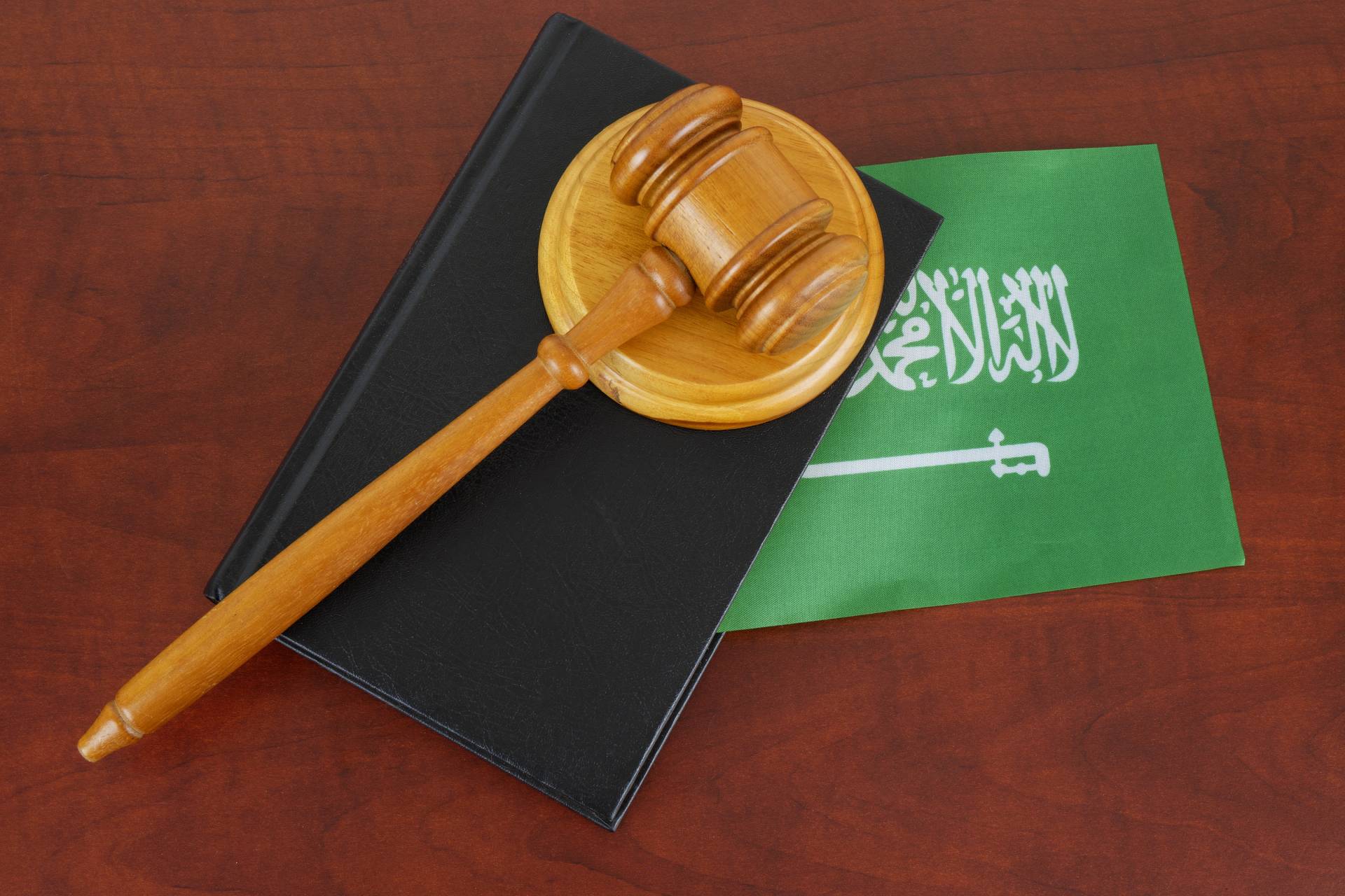 corporate governance in saudi arabia - gavel on book - khalaf bandar law firm
